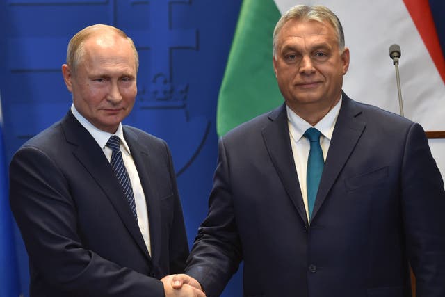 Russia’s Vladimir Putin and Hungary’s Viktor Orban shake hands after a meeting in Budapest in 2019