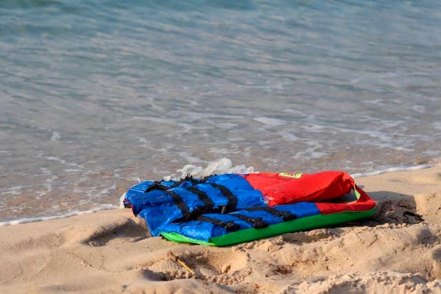 Life jackets litter the beach near the Libyan port of al-Khums