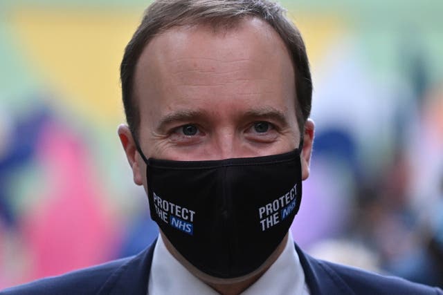 Britain’s Health Secretary Matt Hancock wearing a face mask during a visit with Britain’s Camilla, Duchess of Cornwall (unseen) to watch a demonstration by the charity Medical Detection Dogs, which trains dogs to detect the odour of human disease at Paddington Station on 27 October, 2020 in London, England.