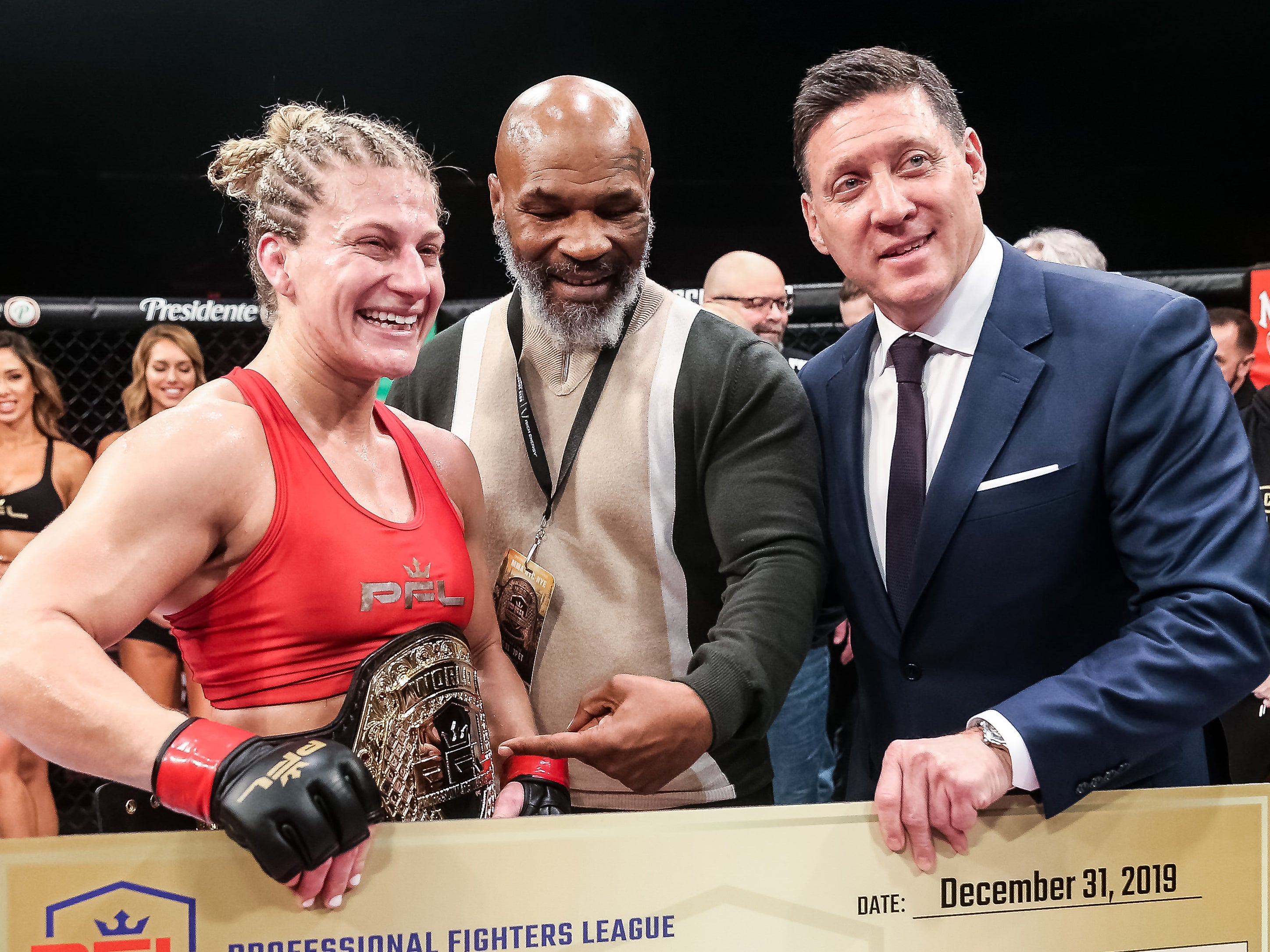 Mike Tyson (centre) with PFL women’s lightweight champion Kayla Harrison and CEO Peter Murray