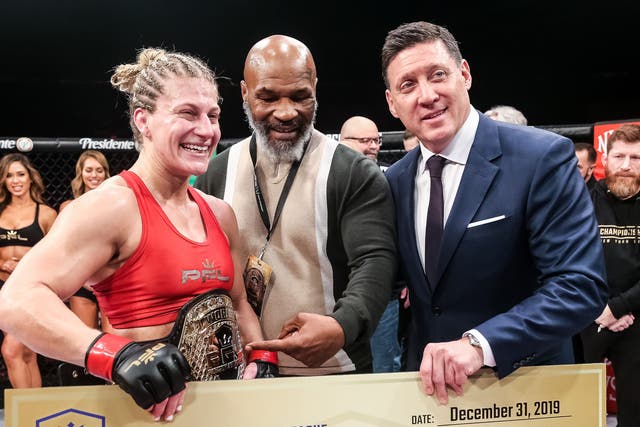 <p>PFL women’s lightweight champion Kayla Harrison with Mike Tyson and CEO Peter Murray</p>