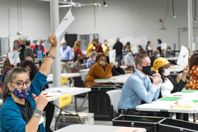 <p>Gwinnett county workers carry out their recount of the ballots on November 13, 2020 in Lawrenceville, Georgia. (Photo by Megan Varner/Getty Images)</p>