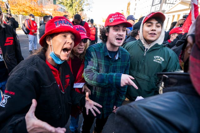 Supporters of US President Donald J. Trump clash with a supporter of President-elect Joe Biden in Black Lives Matter (BLM) plaza outside the White House ahead of an upcoming rally to support Trump's baseless claims of voter fraud in the 2020 presidential election in Washington, DC, USA, 13 November 2020. On 14 November, Pro-Trump and White Nationalist groups plan to converge on DC to protest the election. On 12 November, the Cybersecurity and Infrastructure Security Agency, a division of the Department of Homeland Security, stated 'the November 3rd election was the most secure in American history.'  EPA/JIM LO SCALZO