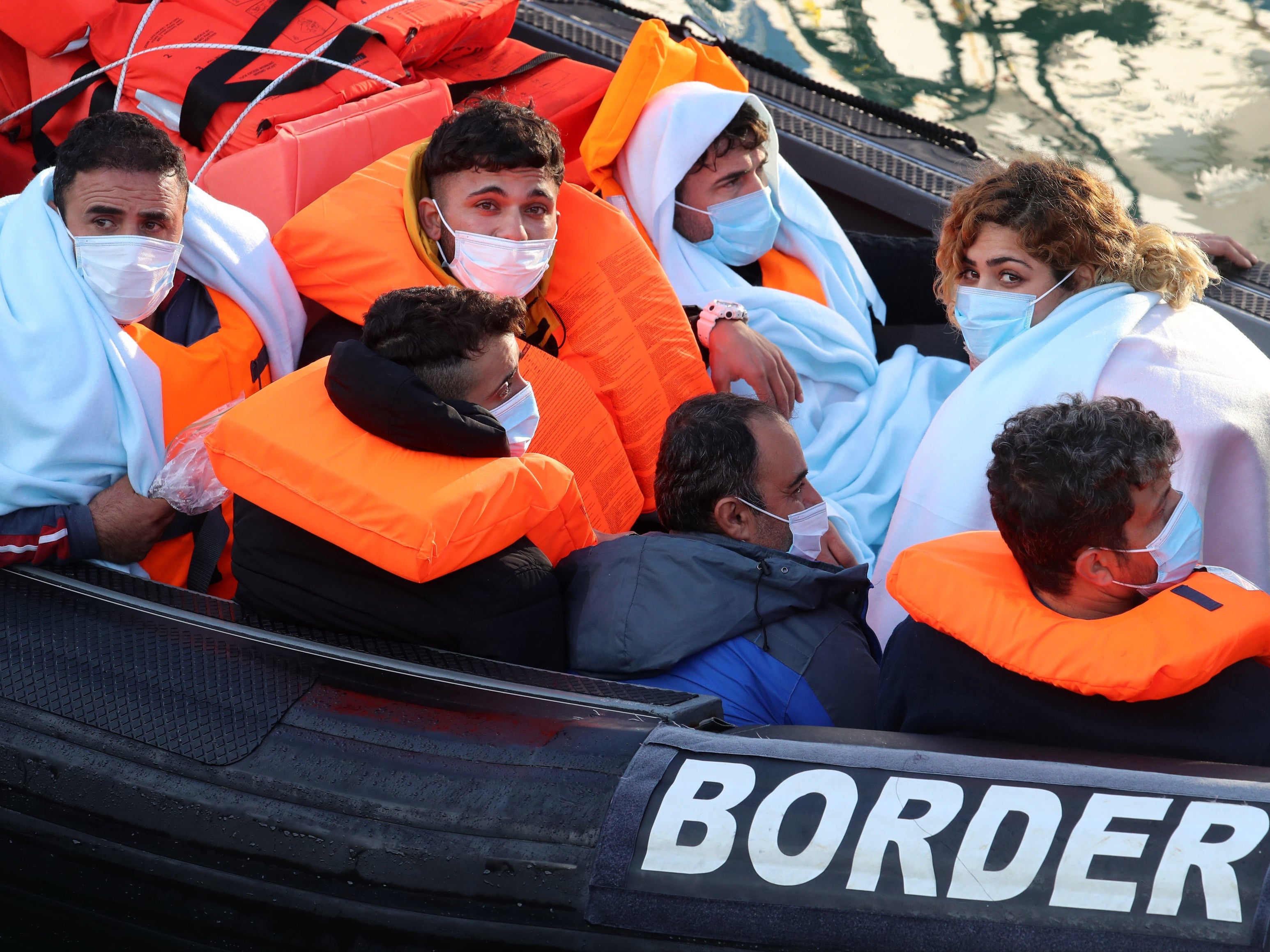 A group of migrants are brought in to Dover, Kent, onboard a Border Force vessel following a small boat incident in the Channel on 7 November 2020