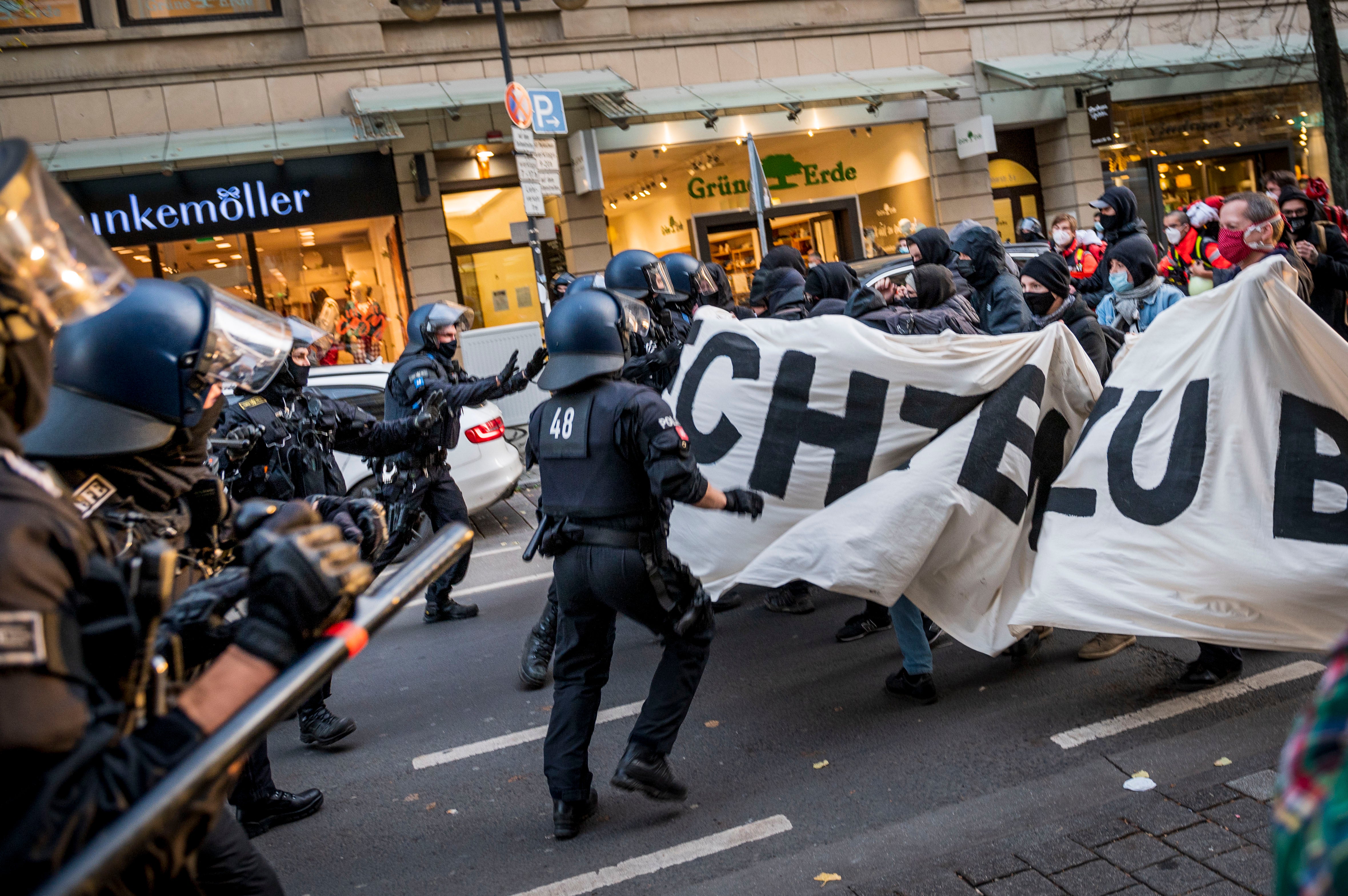 Police clash with left-wing antifa counter-demonstrators protesting against a demonstration of the Querdenker movement