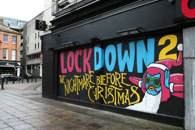 <p>Street art that highlights the current fear of urban life is seen on the wall of Crazy Pedro’s pizza restaurant in Manchester</p>