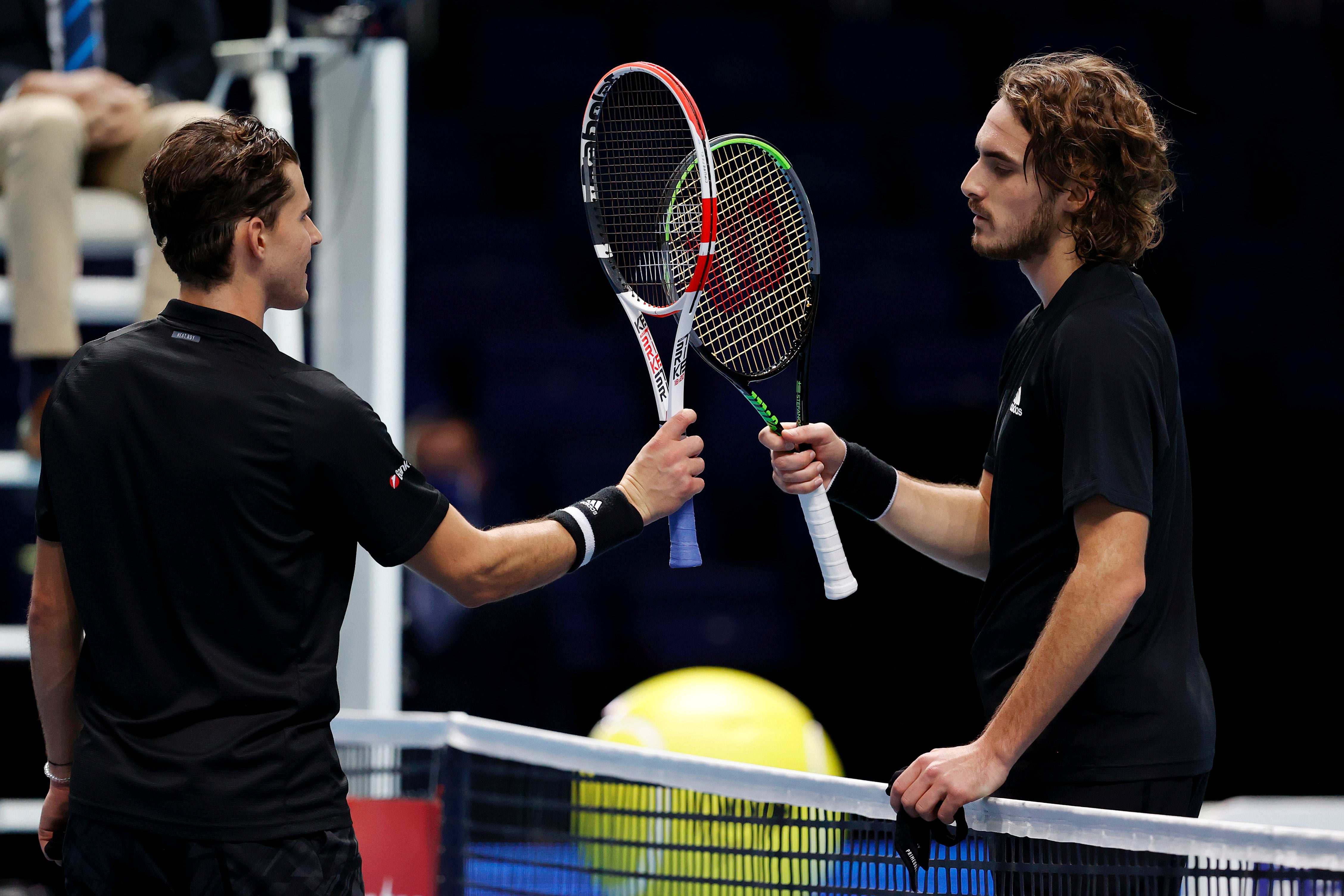 Thiem (left) and Tsitsipas interact after their round-robin meeting