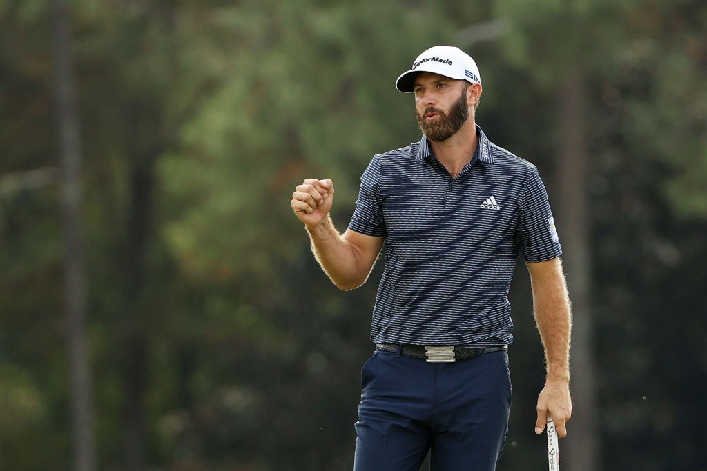 Dustin Johnson celebrates on the 18th green