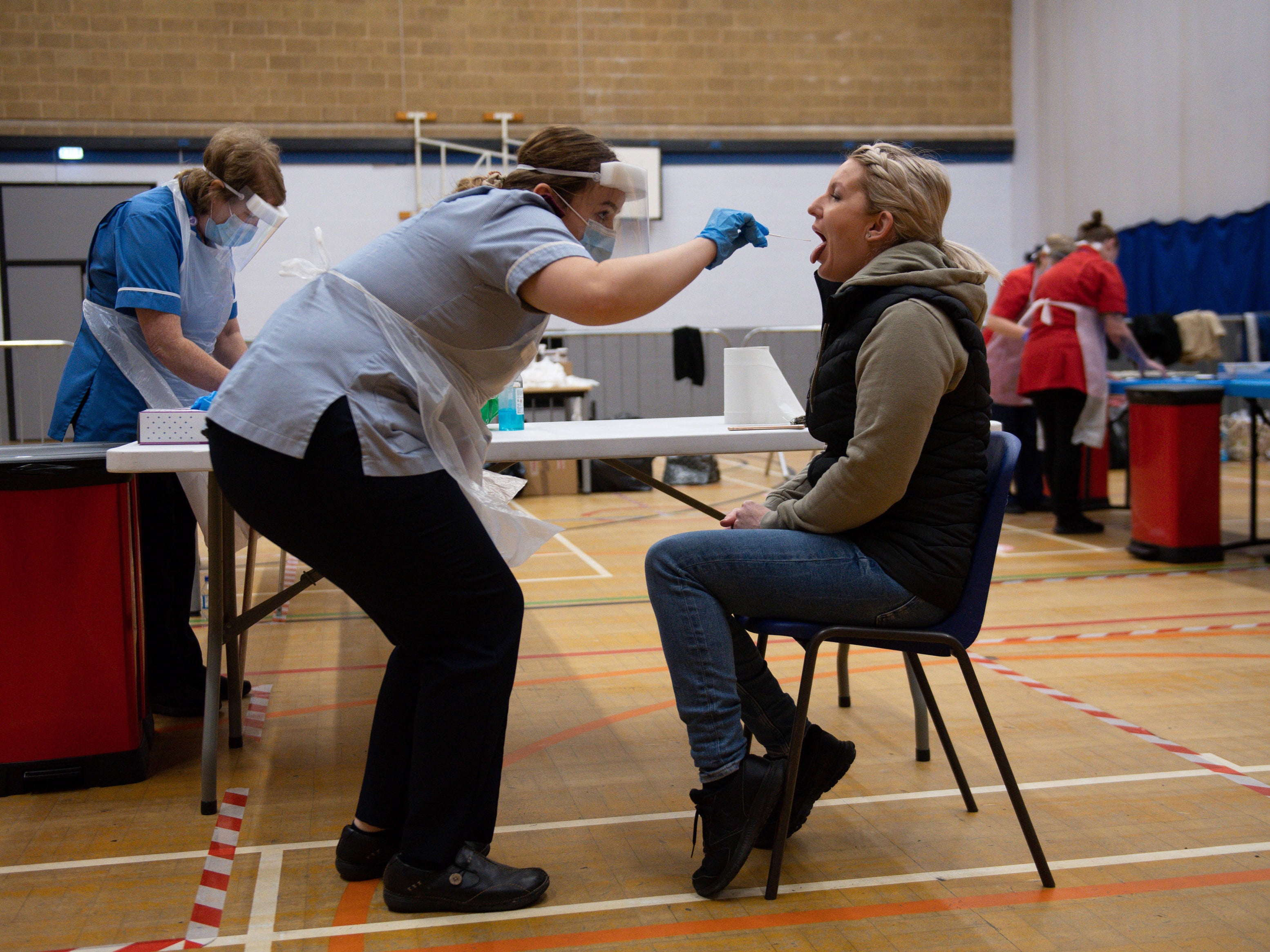 A nurse administers a test at Dimensions Leisure Centre in Stoke-on-Trent