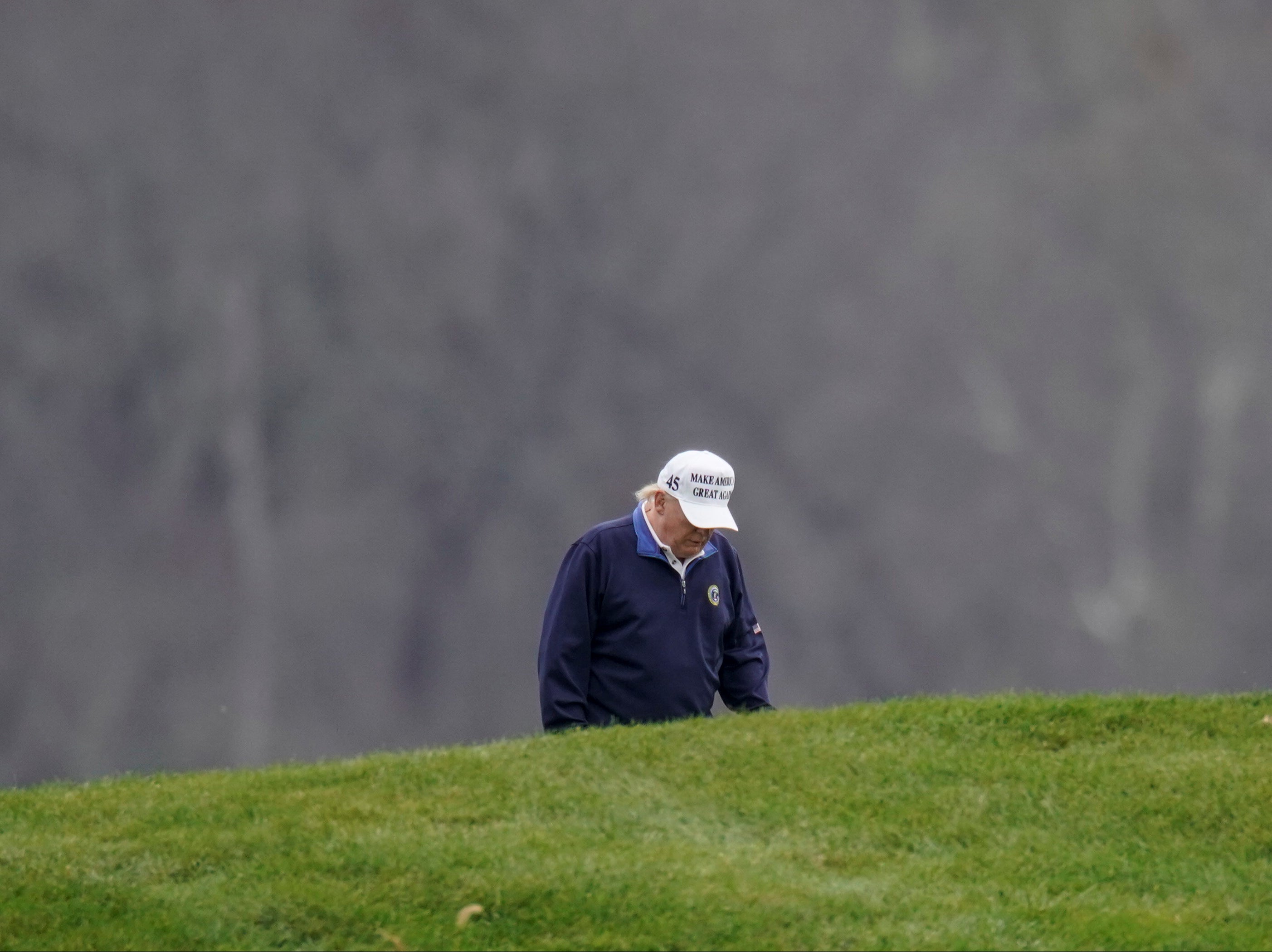 Donald Trump plays golf at the Trump National Golf Club in Sterling, Virginia after appearing to have briefly accepted the result of the 2020 election