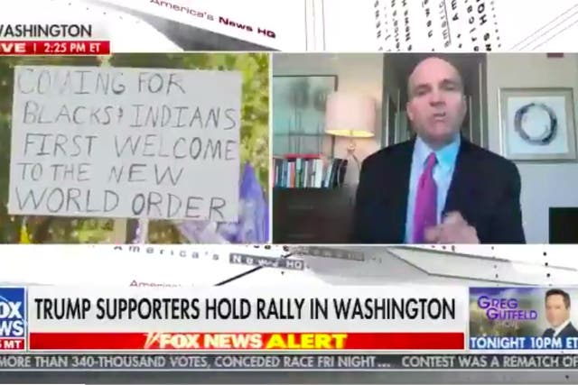 <p>Racist sign spotted at MAGA rally during Fox News broadcast</p>