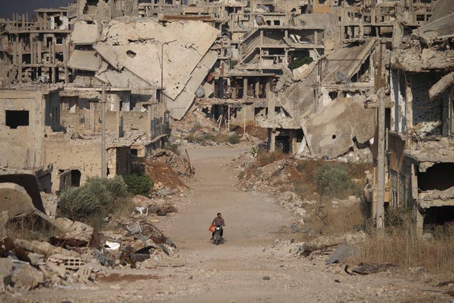 <p>A destroyed street in the city of Daraa in 2018</p>