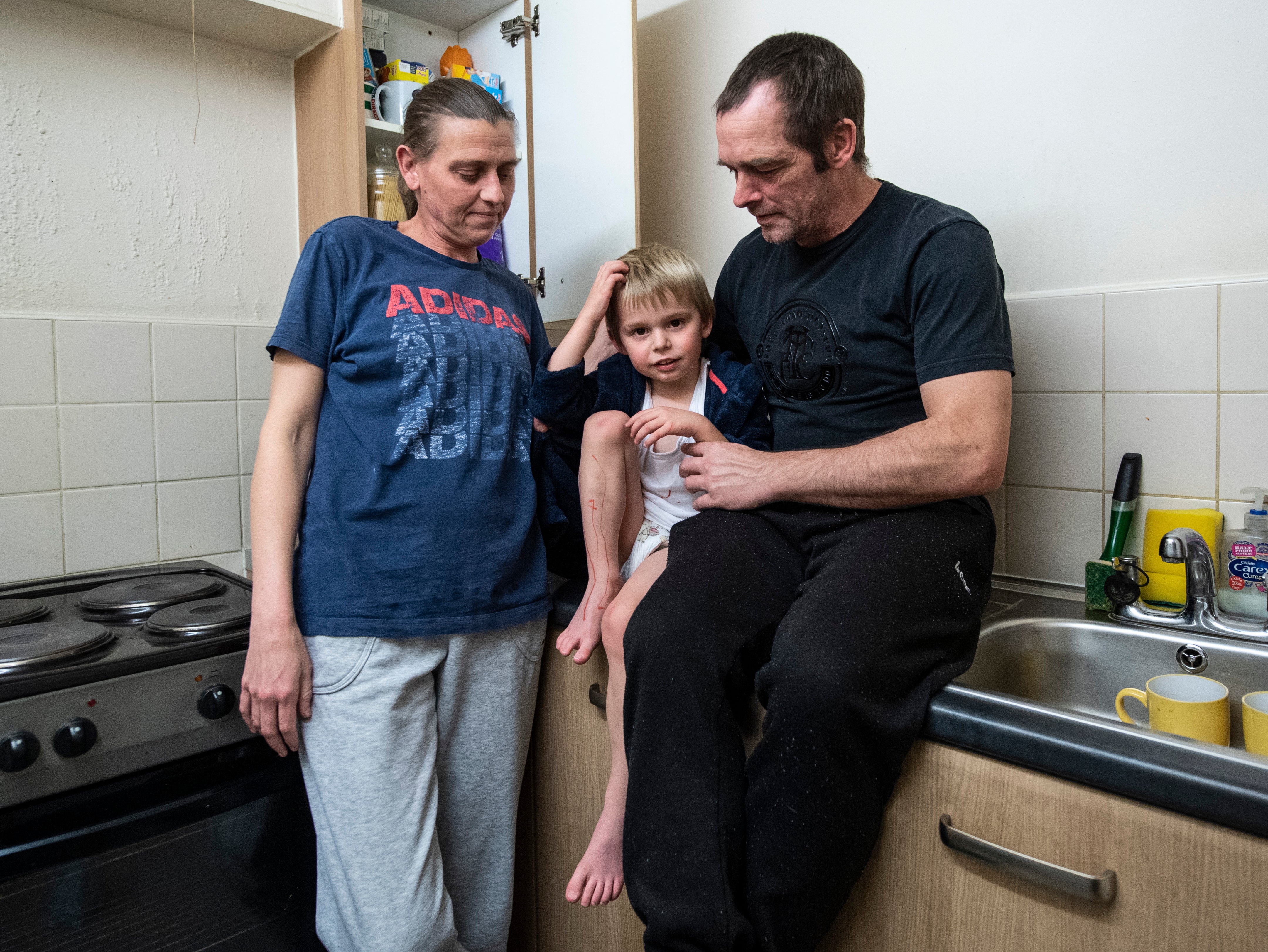 Dave, Rachel and their 4-year-old son Dee-Jay pictured in their one bedroom flat they share in Tottenham, North London.