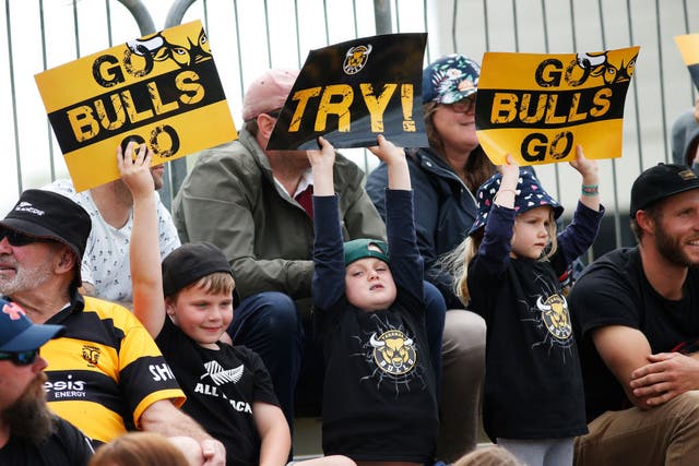 Young fans attend a rugby match in New Zealand earlier this month, a sign that life is gradually returning to normal in East Asian and Pacific nations 