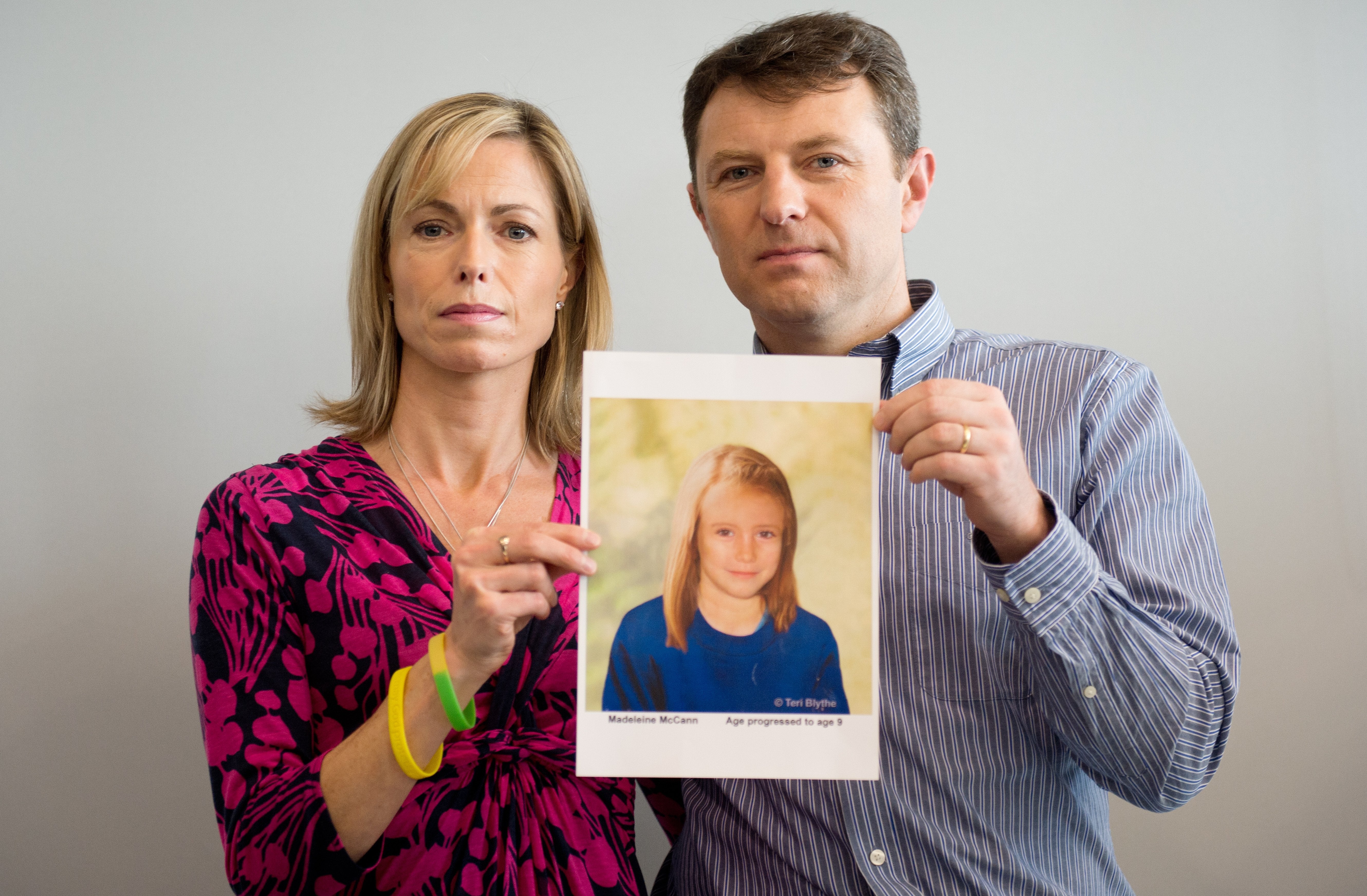 Madeleine’s parents pose five years after her abduction with an artist’s impression of how their daughter might have looked aged nine