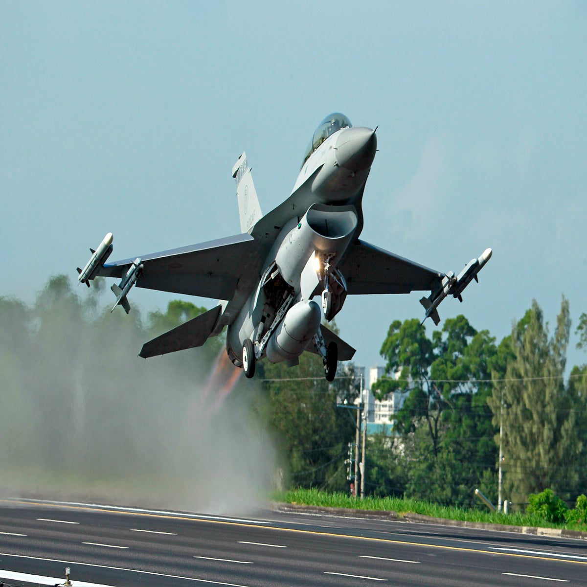 F-16 Fighting Falcons fly overhead during the New York Jets