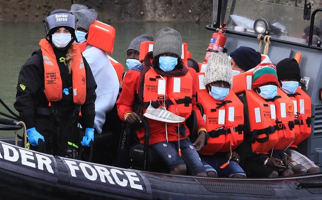 <p>People crossing the English Channel on an inflatable boat near Dover</p>