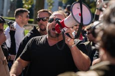 Alex Jones leads Trump supporters on march into Georgia capitol building as top elections official faces death threats