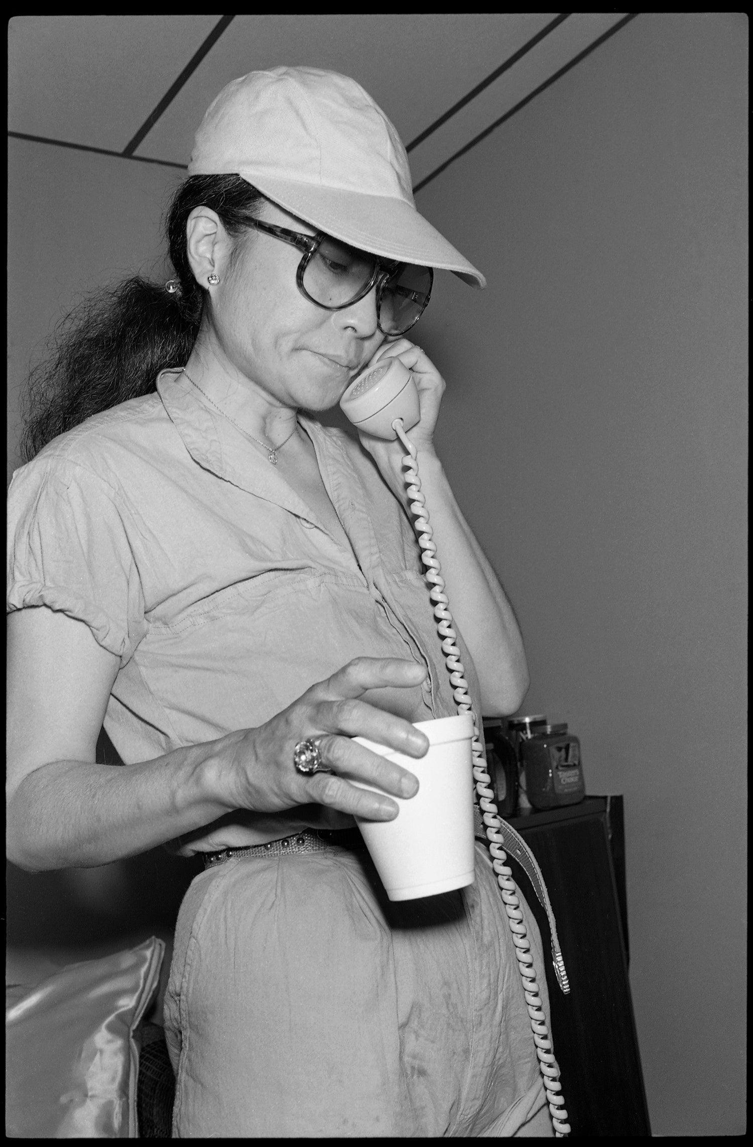 Yoko Ono talks on the phone in the Hit Factory