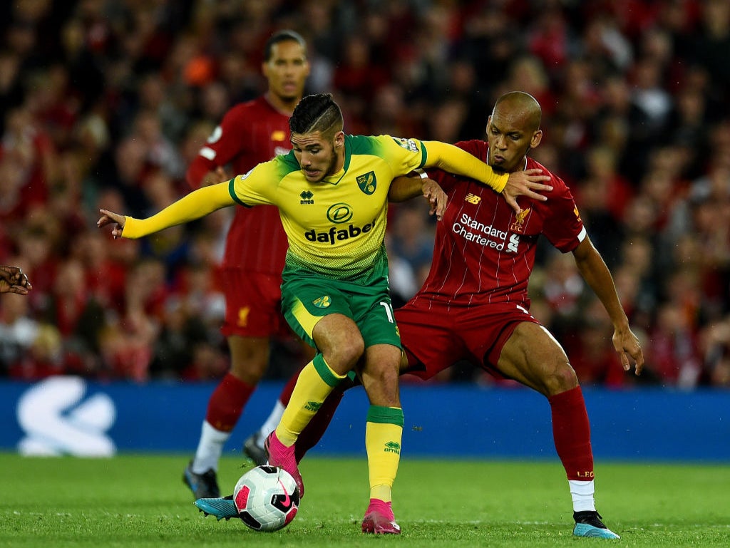 Emiliano Buendia skips away from Liverpool’s Fabinho