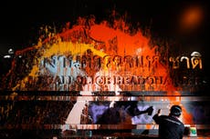 Thailand protesters cover police headquarters with paint after clashes