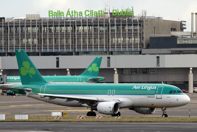 Aer Lingus passenger jets taxi at Dublin Airport in Ireland on January 27, 2015.