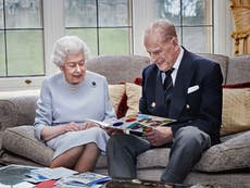 Queen and Prince Philip mark 73rd wedding anniversary with photo of them admiring handmade card from great grandchildren