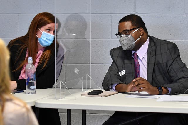 Wayne County Board of Canvassers Chair Monica Palmer, left, talks with Vice Chair Jonathan Kinloch before the board’s meeting in Detroit on 17 November