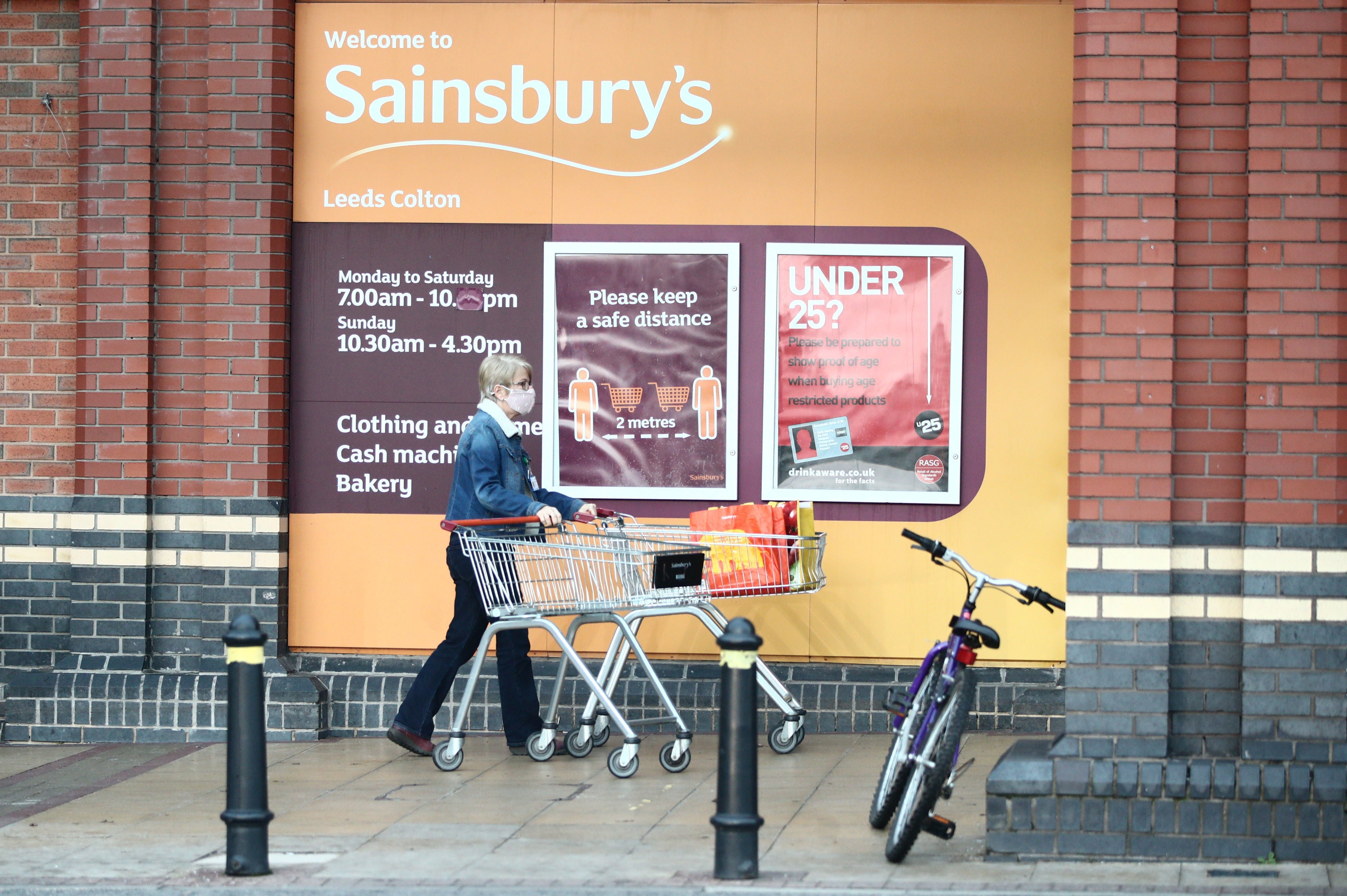 A shopper outside a Sainsbury’s supermarket in Leeds on 5 November, 2020. 