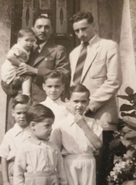 Leslie Biden (back left) along with his brother Arthur and his family in Surrey