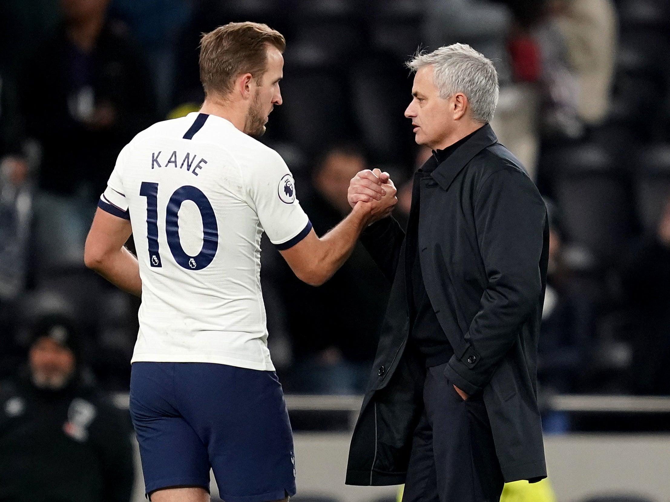 Harry Kane shakes hands with Jose Mourinho