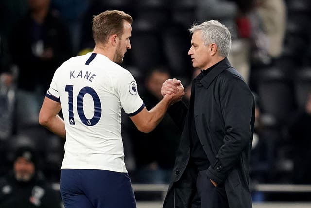 Harry Kane shakes hands with Jose Mourinho