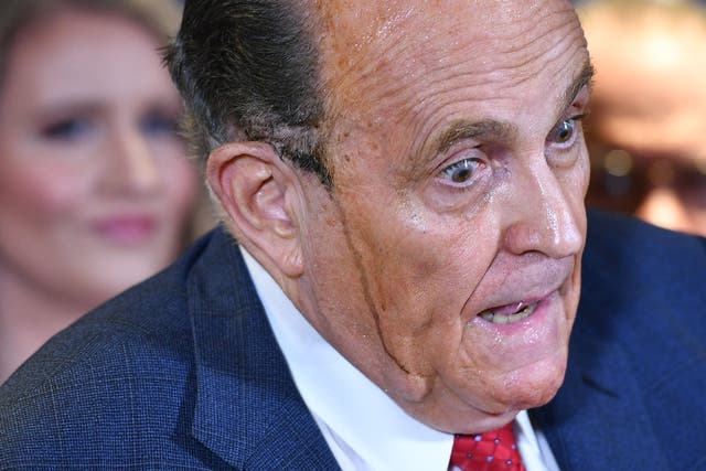 <p>Trump's personal lawyer Rudy Giuliani perspires as he speaks during a press conference at the Republican National Committee headquarters in Washington DC (Photo by MANDEL NGAN / AFP) (Photo by MANDEL NGAN/AFP via Getty Images)</p>