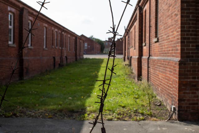 <p>Campaigners have warned that conditions in the barracks are not suitable for housing hundreds of asylum seekers during a pandemic</p>