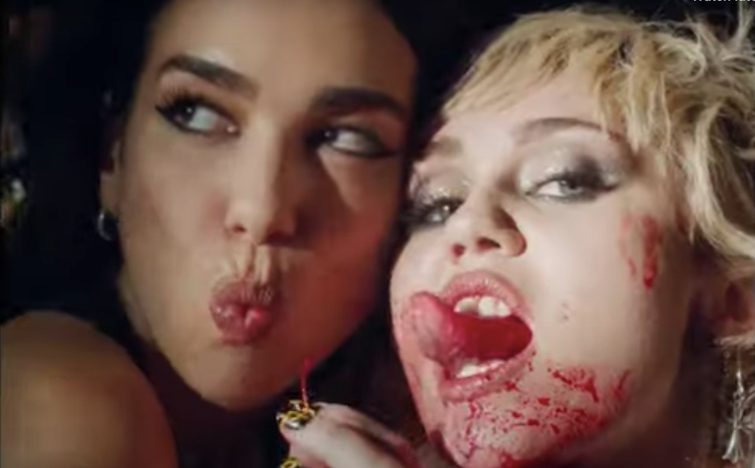 Cyrus with Dua Lipa (left) in the video for ‘Prisoner’