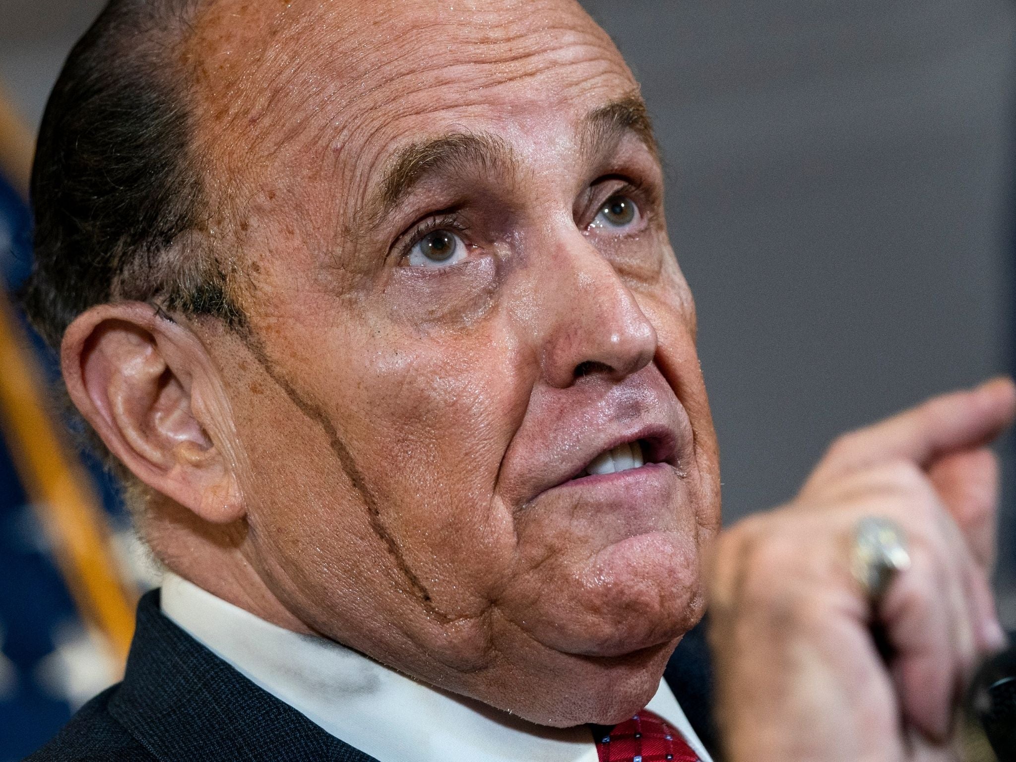 Bad hair day: Giuliani at a recent press conference