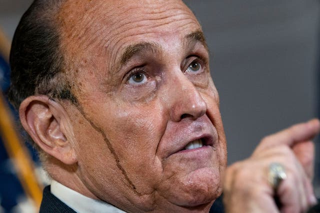 <p>Bad hair day: Giuliani at a recent press conference</p>