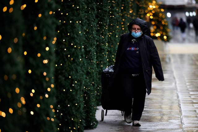 People walk in the rain in central London on 20 November, 2020, during the second national lockdown. 