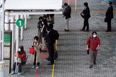 Asia Today: South Korea, Japan mull steps as new cases rise