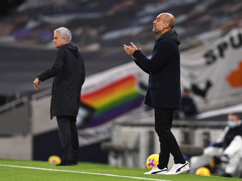 Mourinho and Guardiola watch on from the side