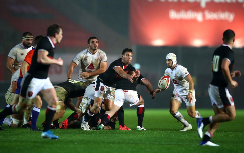 Rhys Webb of Wales passes out from the back of the ruck