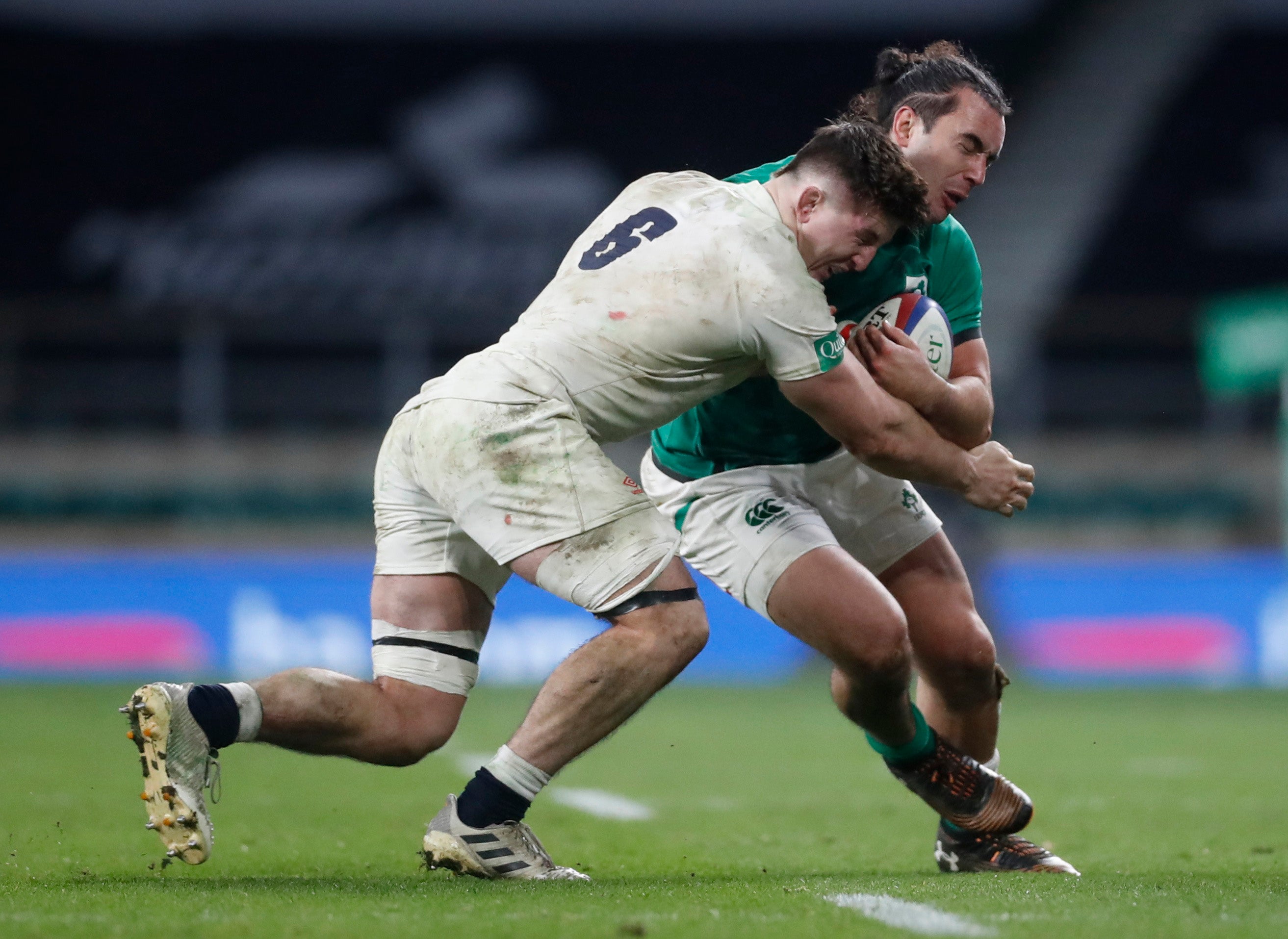 Tom Curry makes one of his 23 tackles during the win over Ireland on James Lowe