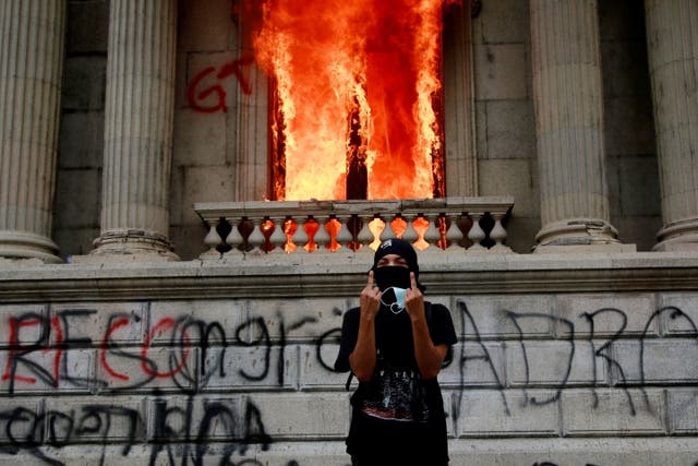 <p>Flames poured out of the windows of the legislative building in Guatemala City yesterday afternoon.</p>