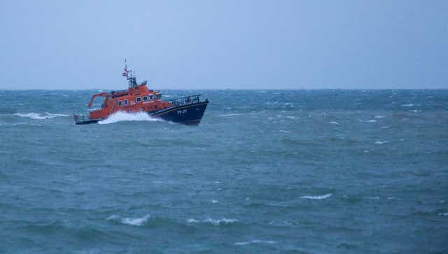 The RNLI severn class Lifeboat head to Newhaven harbour after searching for the missing two fishermen that went missing near Seaford, Sussex, when their fishing boat,  Joanna C, sank off the coast near Seaford, East Sussex on Saturday. 