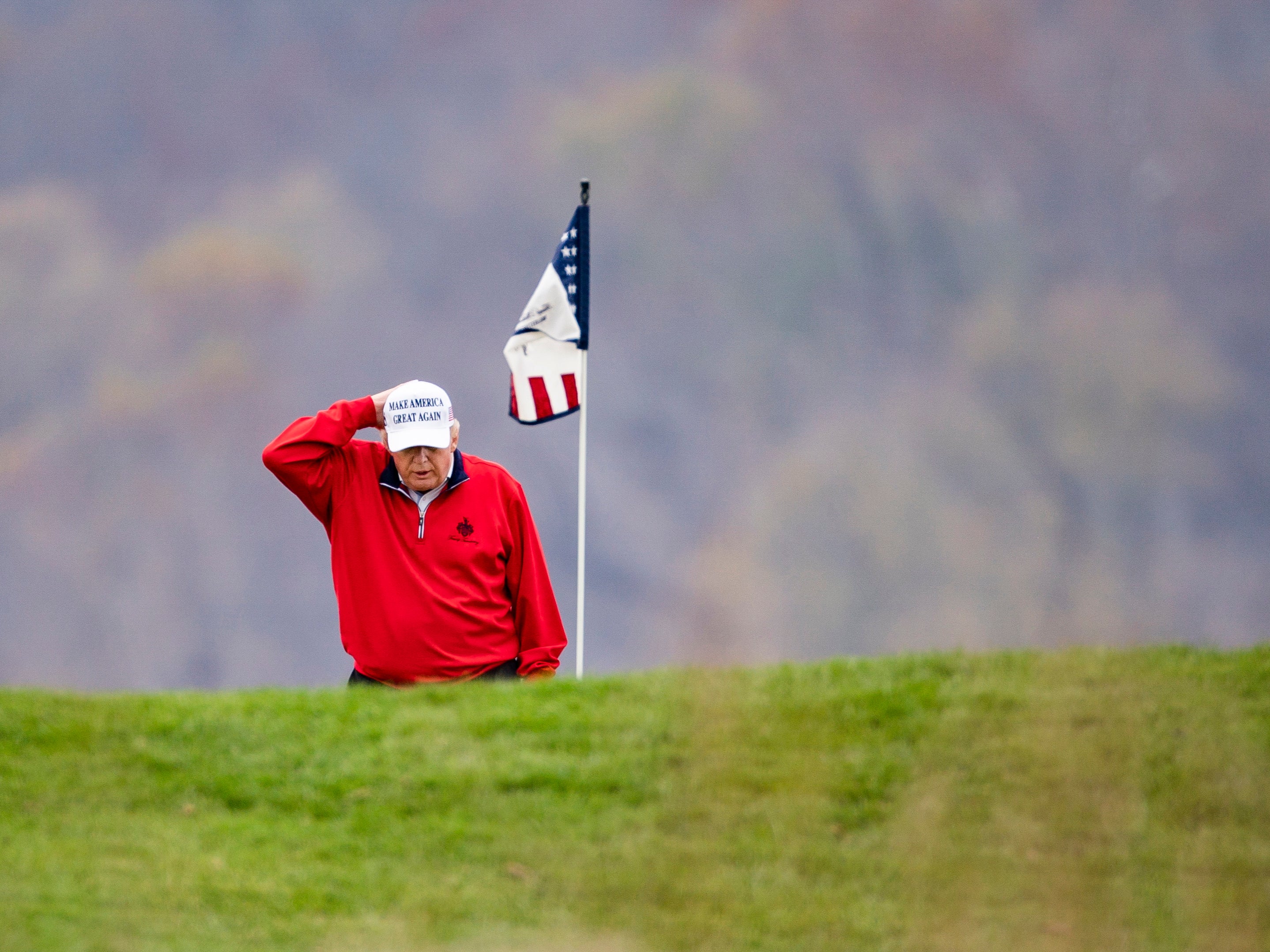 President Donald Trump plays golf for the 143rd time since becoming president at the Trump National Golf Club in Sterling, Virginia, USA, 21 November 2020