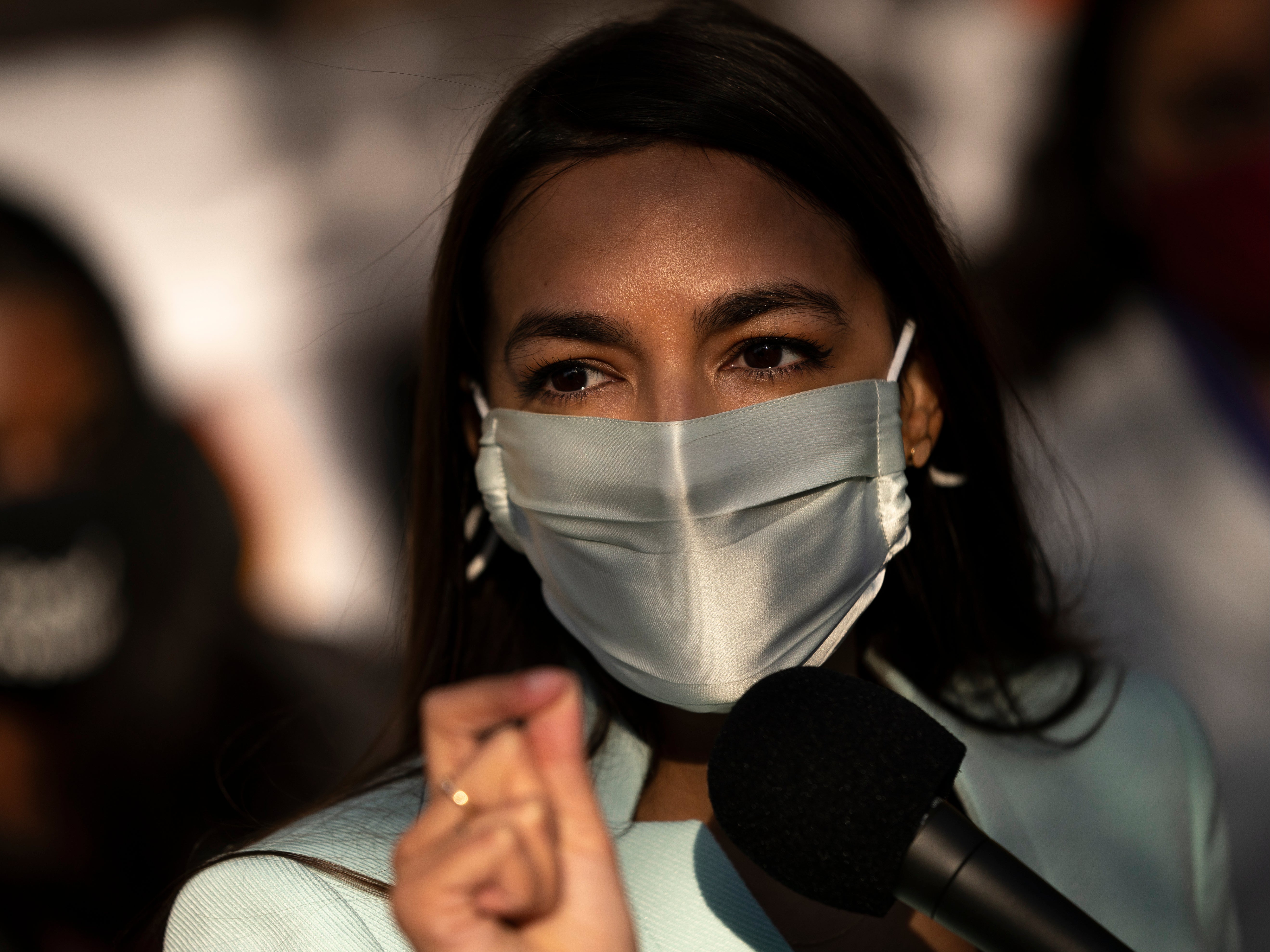 US Rep Alexandria Ocasio-Cortez speaks outside of the Democratic National Committee headquarters on 19 November, 2020 in Washington, DC.
