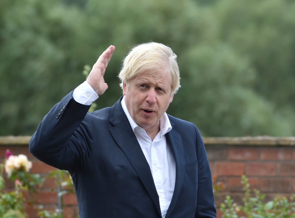 Britain’s Prime Minister Boris Johnson speaks to local people at the Canal Side Heritage Centre in Beeston, central England, on July 28, 2020, during an event to launch the the government’s new cycling initiative to help get people fitter. The Johnson government has ramped up its efforts to address obesity in Britain.