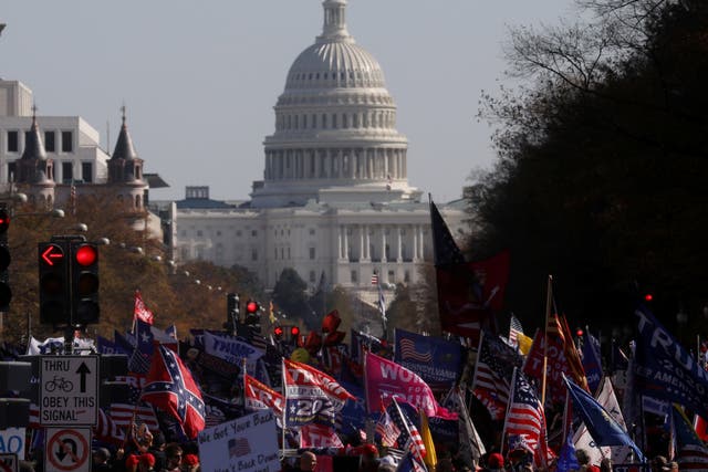 The US Capitol building is visible as thousands of people participate in rallies in support of Donald Trump in Washington, US, 14 November