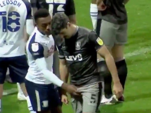 Fisher grabs Paterson in the mid-section