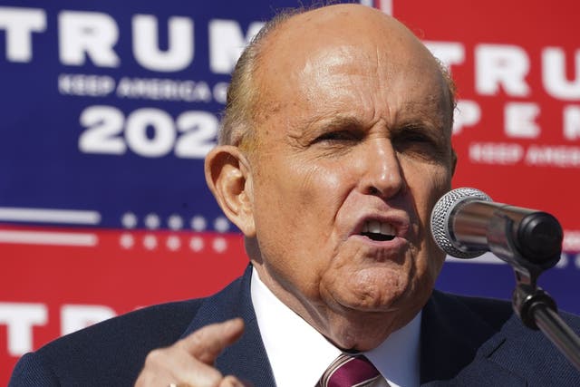 Attorney for the President, Rudy Giuliani, speaks at a news conference in the parking lot of a landscaping company on 7 November, 2020 in Philadelphia